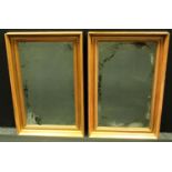 A pair of Victorian giltwood looking glasses, rectangular mirror plates,