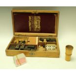 An early 20th century games compendium, the fitted box containing two boards, chess set,