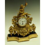 A 19th century French gilt metal mantel clock, white enamel dial, with Roman numerals,