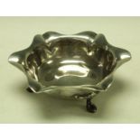 A silver Art Nouveau bowl, flared petal form raised on three stylised pad feet,