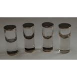 A set of four Edwardian silver mounted clear glass cylindrical condiment shakers, 10.