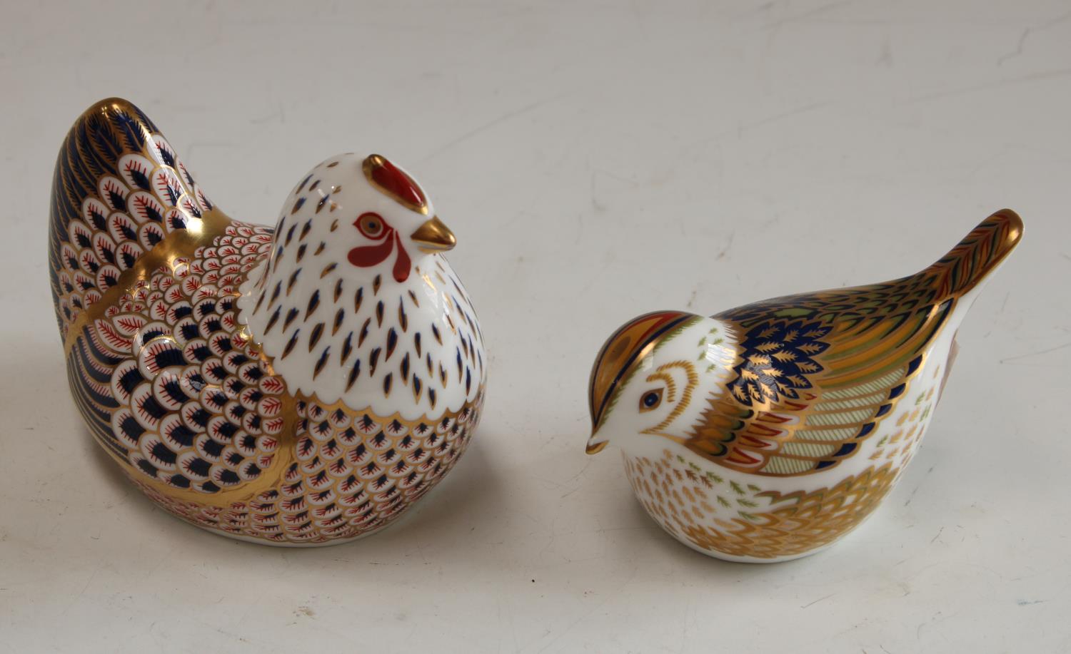 A Royal Crown Derby paperweight, Chicken, printed mark, gold stopper; another, Firecrest,