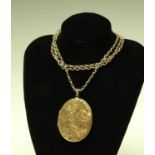 A late 19th century 9ct gold guard chain and locket pendant, the pendant marked 375, 32.