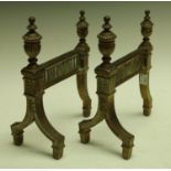 A pair of early 20th century andirons, urn finials,