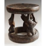 Tribal Art - a West African hardwood stool, possibly Kwele, Gabon, dished circular top,