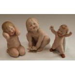A Gebruder Heubach bisque piano baby, naked, mischievous grin, 17cm,