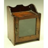 An Edwardian oak smoking room cabinet, c.