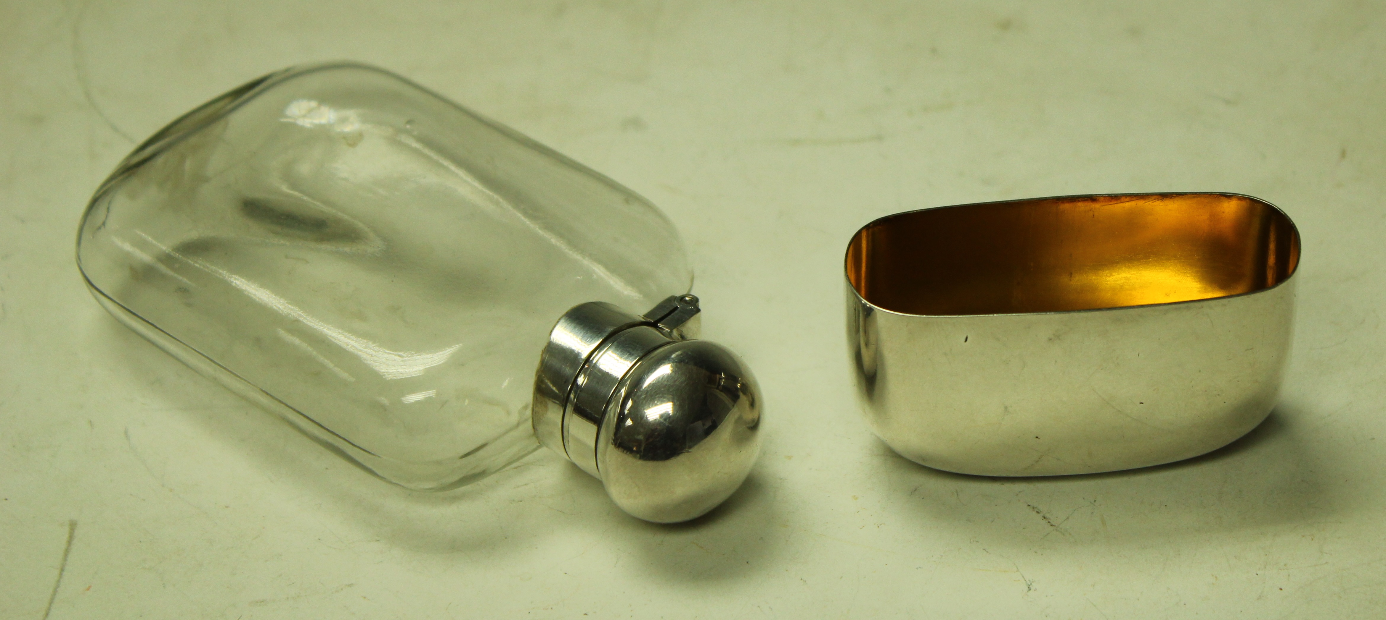 A silver coloured metal and clear glass flask, twist-cap cover, - Image 2 of 2