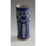 A Wedgwood Jasperware cylindrical vase, applied with stiff leaves below,