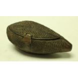 Tribal Art - an unusual snuff box carved from a tear shaped nut probably c.