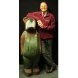 A huge novelty carved softwood garden sculpture, anthropomorphic bear,