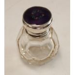 An early 20th century multi-faceted glass scent or smelling salts bottle,