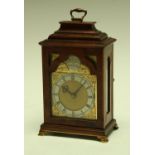 A late George VI walnut carriage clock,