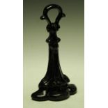 A cast iron door stop