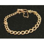 A 9ct rose gold graduated link Albert chain bracelet, 19cm long,