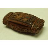 A 19th century French coquilla carved pillow shaped snuff box, 7cm wide,