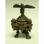 A Renaissance Revival bronze tripod inkwell, eagle cresting, boldly cast satyr monopodia, 16.