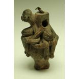 A South American clay figural vessel, in the typical Pre-Columbian manner, 21.