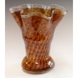 A large Powell type brown glass vase, fluted rim, spiral bubble inclusions,