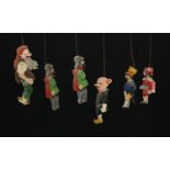 Six Continental wooden puppets, painted in colours, c.