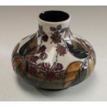 A contemporary Moorcroft Leaf and Berries pattern compressed ovoid vase,
