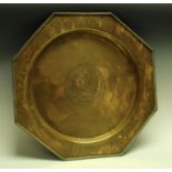 An Indo-Chinese brass octagonal charger, chased and engraved with cockerel, deer,