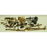 A collection of architectural and furniture brass fittings, paw feet, door handles,