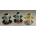 A Susie Cooper set of six harlequin coffee cans and saucers