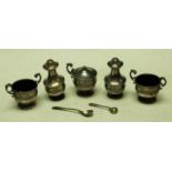A silver three piece condiment set, Sheffield 1917; a pair of silver salts,