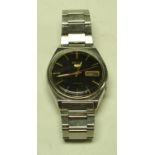 A Seiko day/date wristwatch, black face,