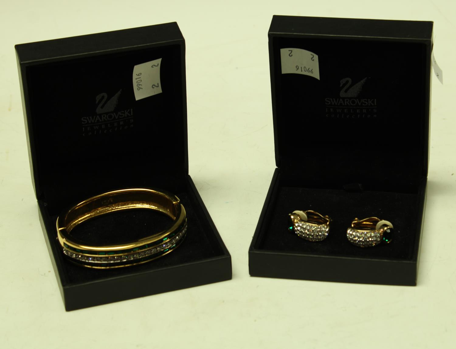 A Swarovski crystal bangle and clip earring part suite,