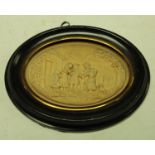 A 19th century wax picture, in relief with a genre scene, oval, 7cm x 9.