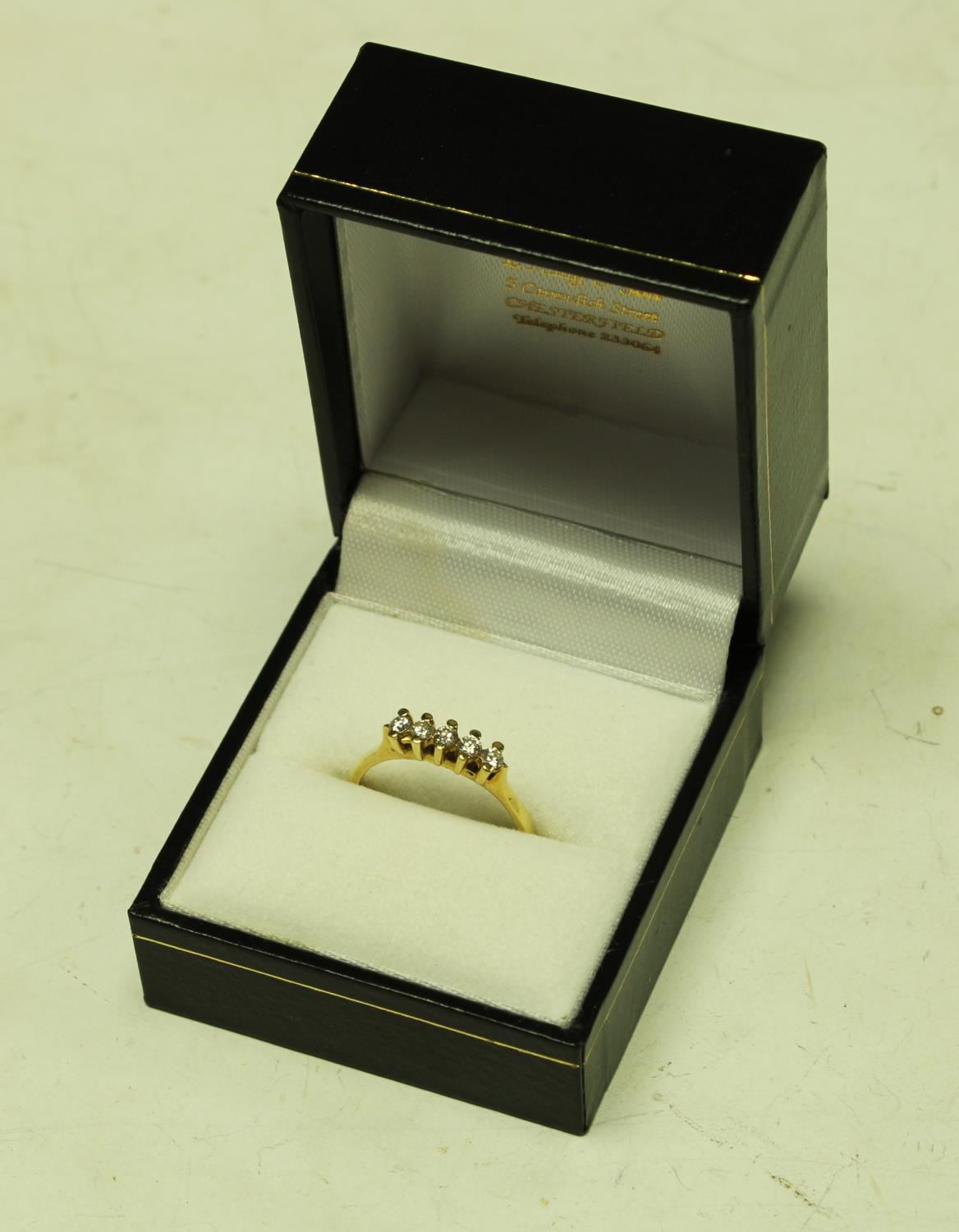 An 18ct gold five stone diamond ring, 2.