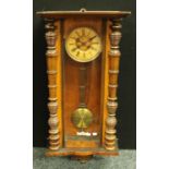 A mahogany Vienna wall clock, Roman numerals, key and pendulum,
