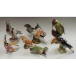 A Beswick model of a Woodpecker, number 1218, 23cm; others, Jay, number 1219, 15cm; Owl,