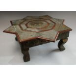 An Indian embossed metal mounted Bajot/opium tea table, 18cm high, 50cm wide,