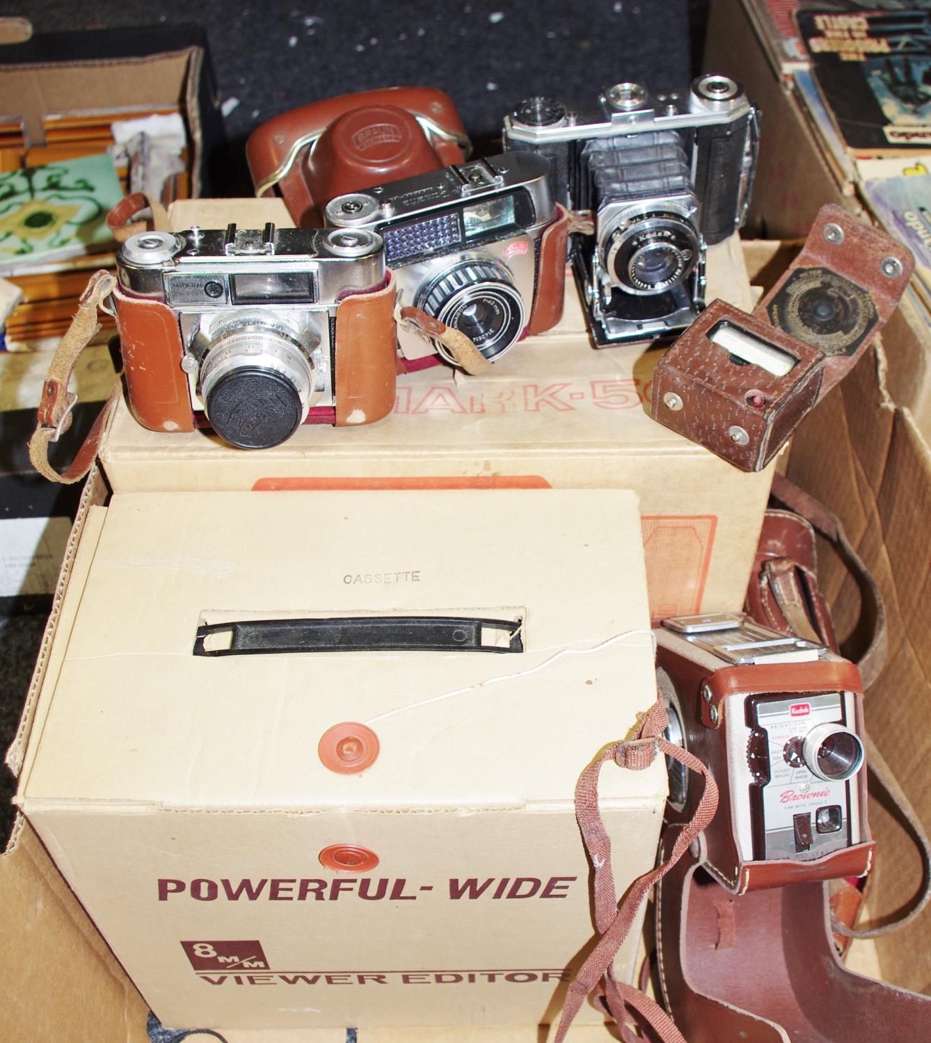 Photography interest - a Kodak Compur bellows camera; a Braun Paxette 35mm camera;