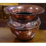 An Arts and Crafts copper jardiniere, everted rim, ovoid base embossed with scrolling foliage.