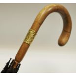 An 18ct gold mounted gentleman's umbrella, the cartouche monogrammed GW,