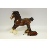 A Beswick shire horse; a Beswick recumbent foal.