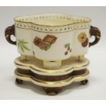 A Royal Worcester Aesthetic Movement quatrefoil shaped raised bowl with elephant mask handles