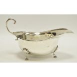 A George V silver sauce boat, scroll handle, hoof feet, J W Benson, Birmingham, 1912 101.