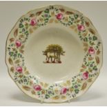 An 19th century Derby cabinet plate with bull and oak tree family crest monogram with cabbage