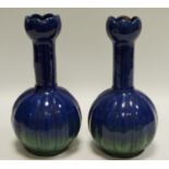 A pair of lobed, globular vases incised Edward Sadler,