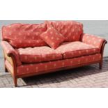 An Empire style mahogany settee, canework back and sides.