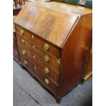 A George III flame mahogany bureau fall front opening to fitted interior over four graduated