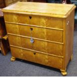 A maple chest of four graduated drawers, scrolling forelegs.