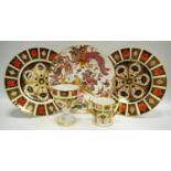 A Royal Crown Derby 1128 dinner plate 27cm diameter (1st); another (2nd);