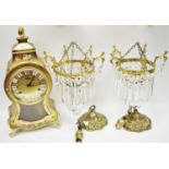 A pair of early 20th century gilt metal chandeliers;