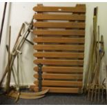 Tools - two scythes; hoes; tree loppers; rake; forks; garden gate; cannon barrel brush.